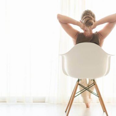 woman relaxing in chair; grief exhaustion: 7 ways to rest