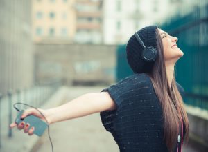 Woman listens to Christian songs on gratitude and thanksgiving