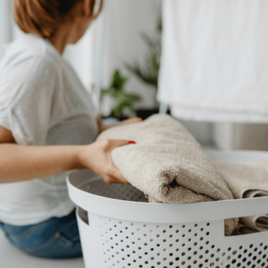 woman does laundry in grief