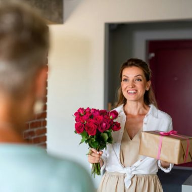 woman bringing flowers and help to grieving woman